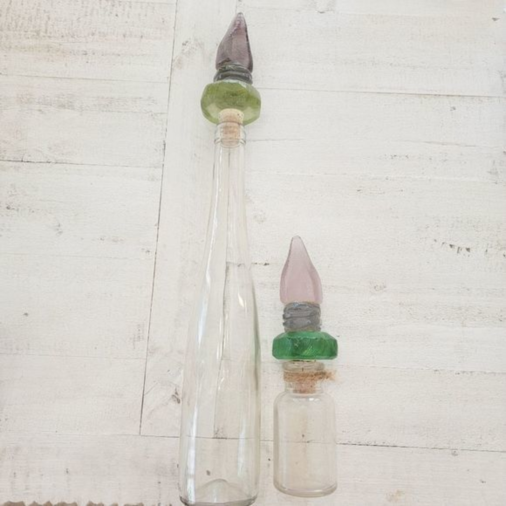 Set of bottles 16 in tall 8 in tall 2 with glass Corks green purple crystal look